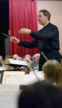 Lawrence Isaacson conducts the PCO