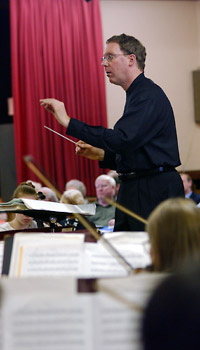 Lawrence Isaacson conducts the PCO