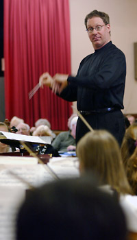Lawrence Isaacson conducts the PCO