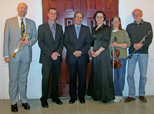 Orchestra members with Folsom and May Funeral Home representatives, sponsor of this concert.