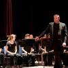 Scott Abrahamson, Director of the Dedham High School Concert Band, conducts "March to the Prince of Wales" performed by members of the Concert Band with members of the Parkway Concert Orchestra.